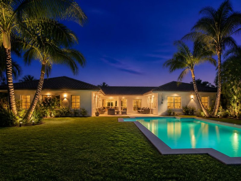 Twilight exterior photograph of a home